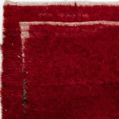 Tapis Tulu turc vintage rouge uni noué à la main avec une bordure minimaliste ivoire. 100 % laine.