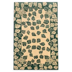 Tapis vert moderne fait main en laine crème, motif feuilles
