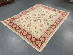 Tapis Ziegler crème à bordure rouge, tapis oriental floral en laine noué à la main