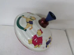 Toupie ancienne en tole litho decor enfentin