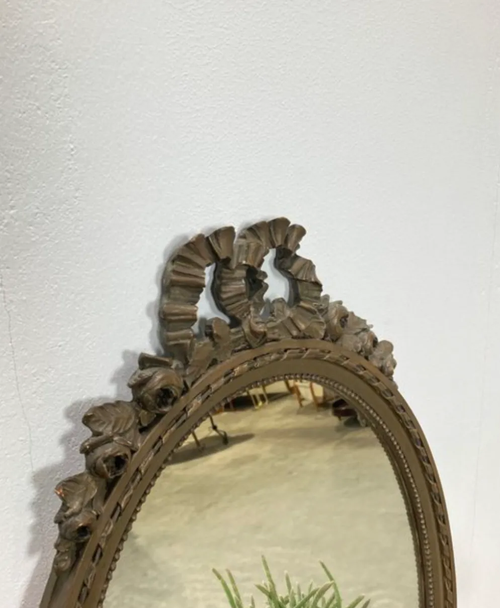 Vintage wooden mirror with arch and flowers