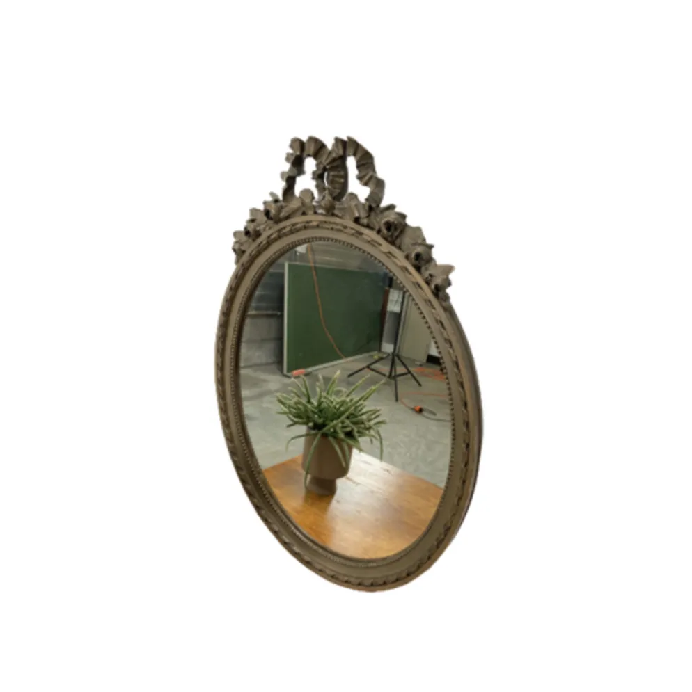 Vintage wooden mirror with arch and flowers