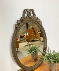 Vintage wooden mirror with arch and flowers